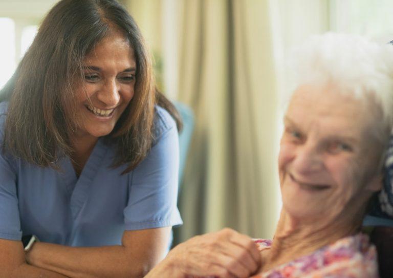 Home health clinician with an older adult patient